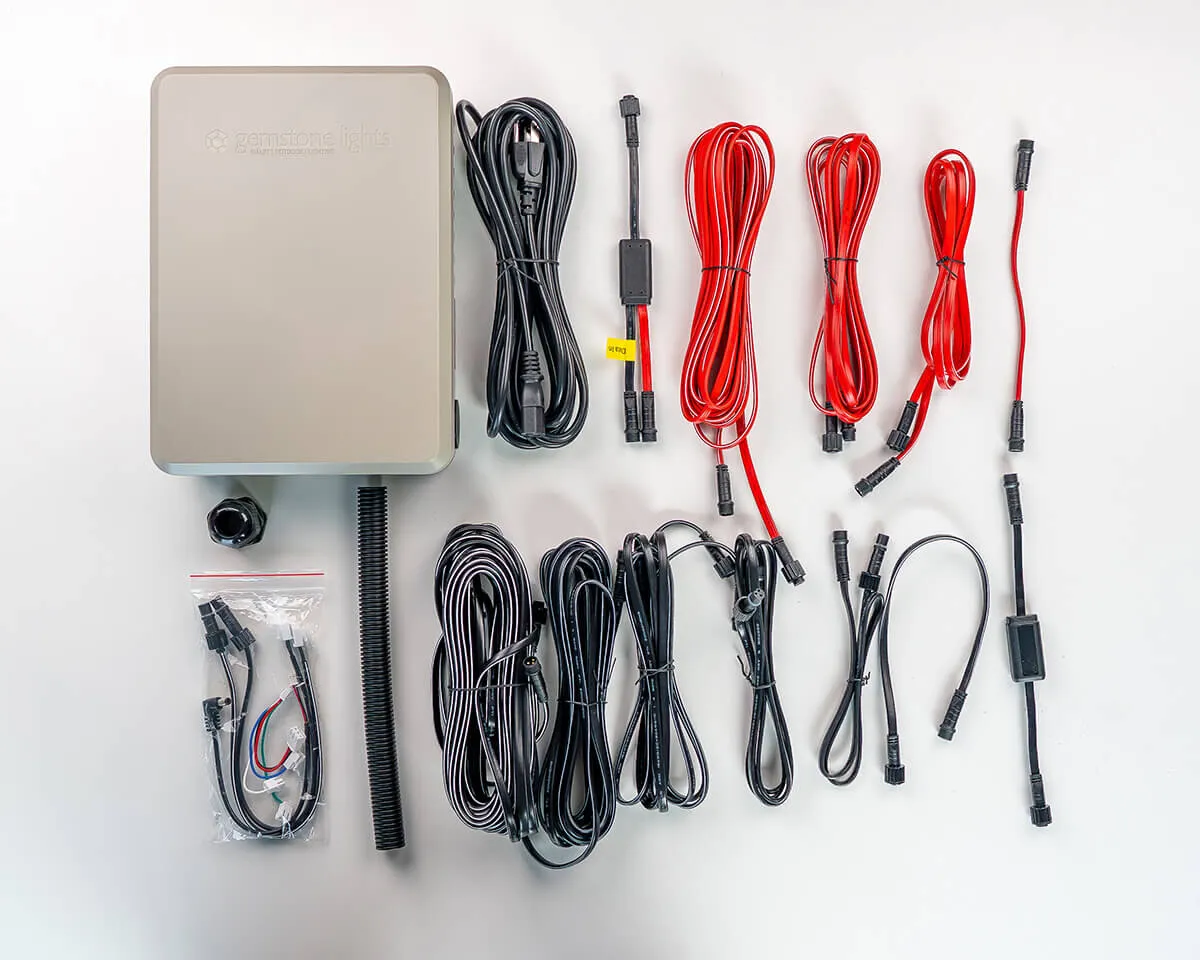 Flat lay of the Gemstone 48V power kit: control box, cords and cables