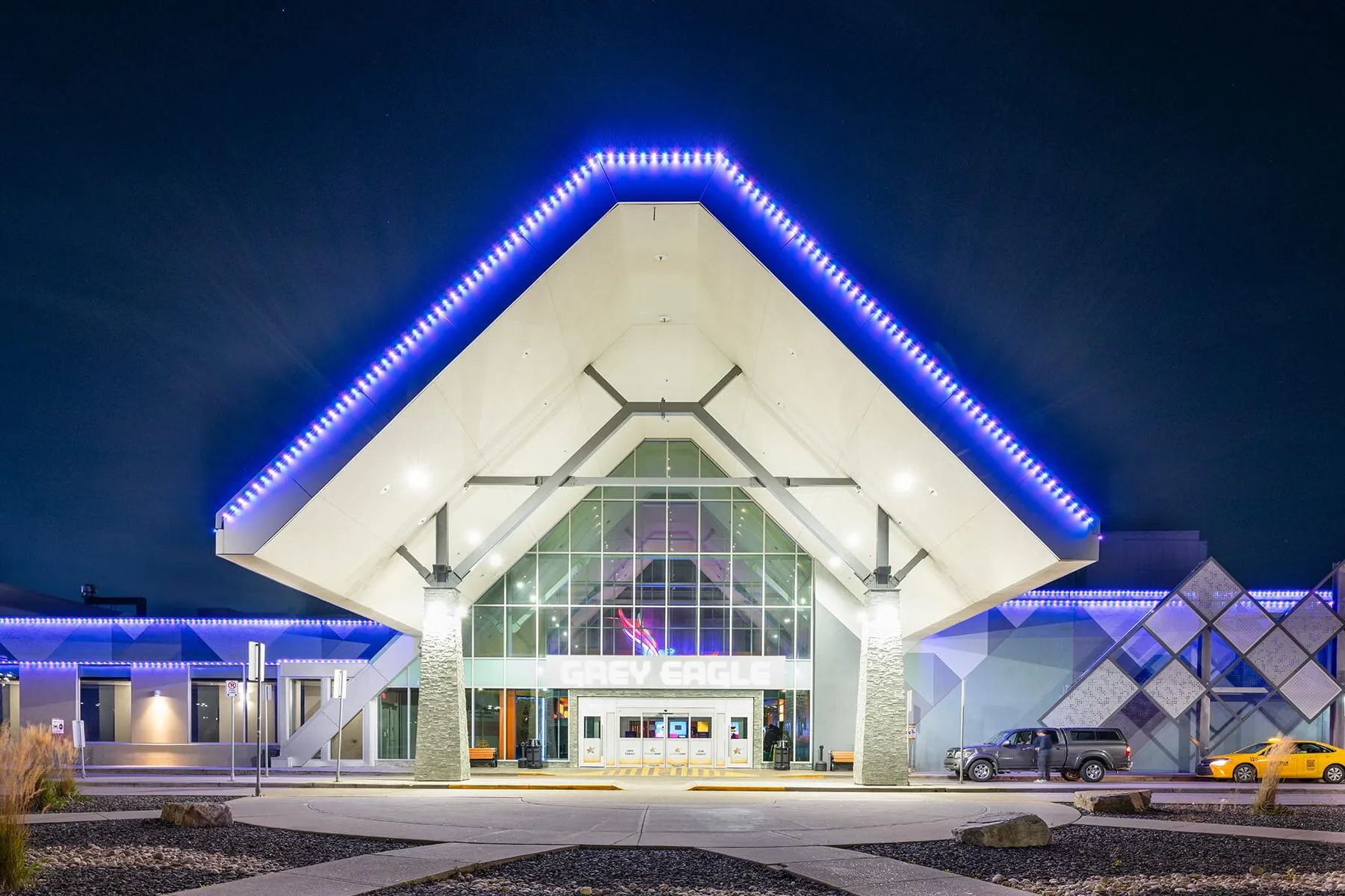 Commercial building entrance outlined in blue light