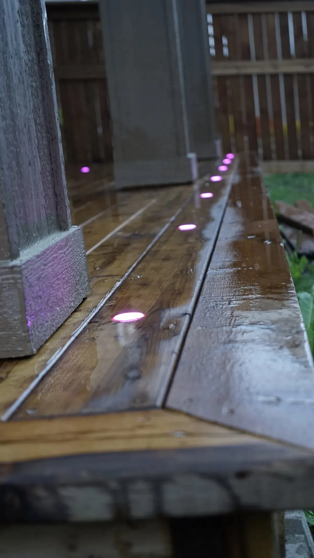 Deck lights set into a wet deck board edge