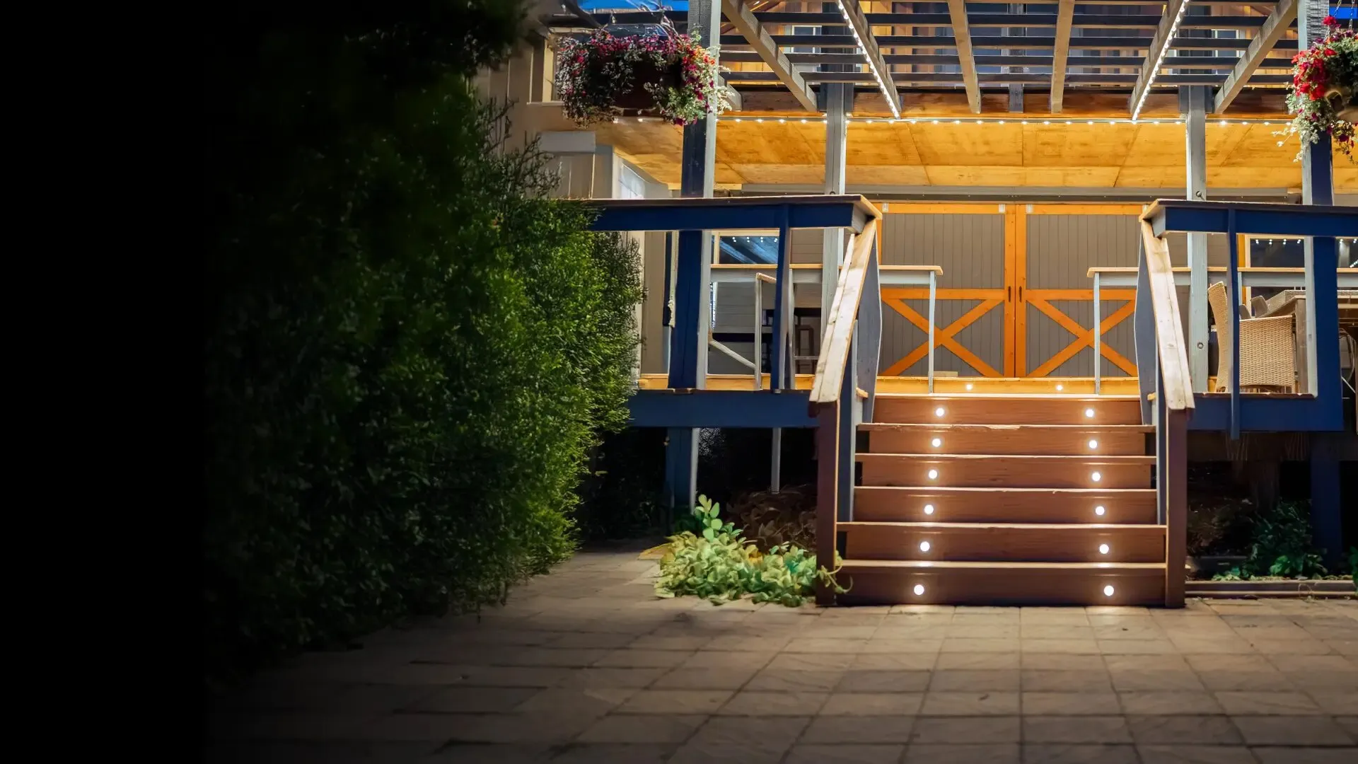 Deck stairs and pergola with warm white Gemstone deck lights set into each tread