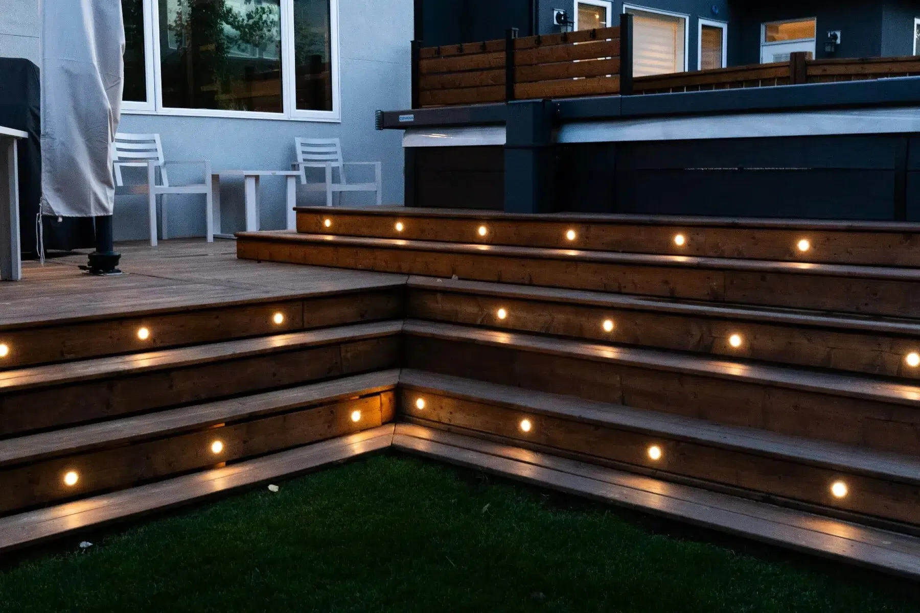 Multi-tier deck steps lit at dusk