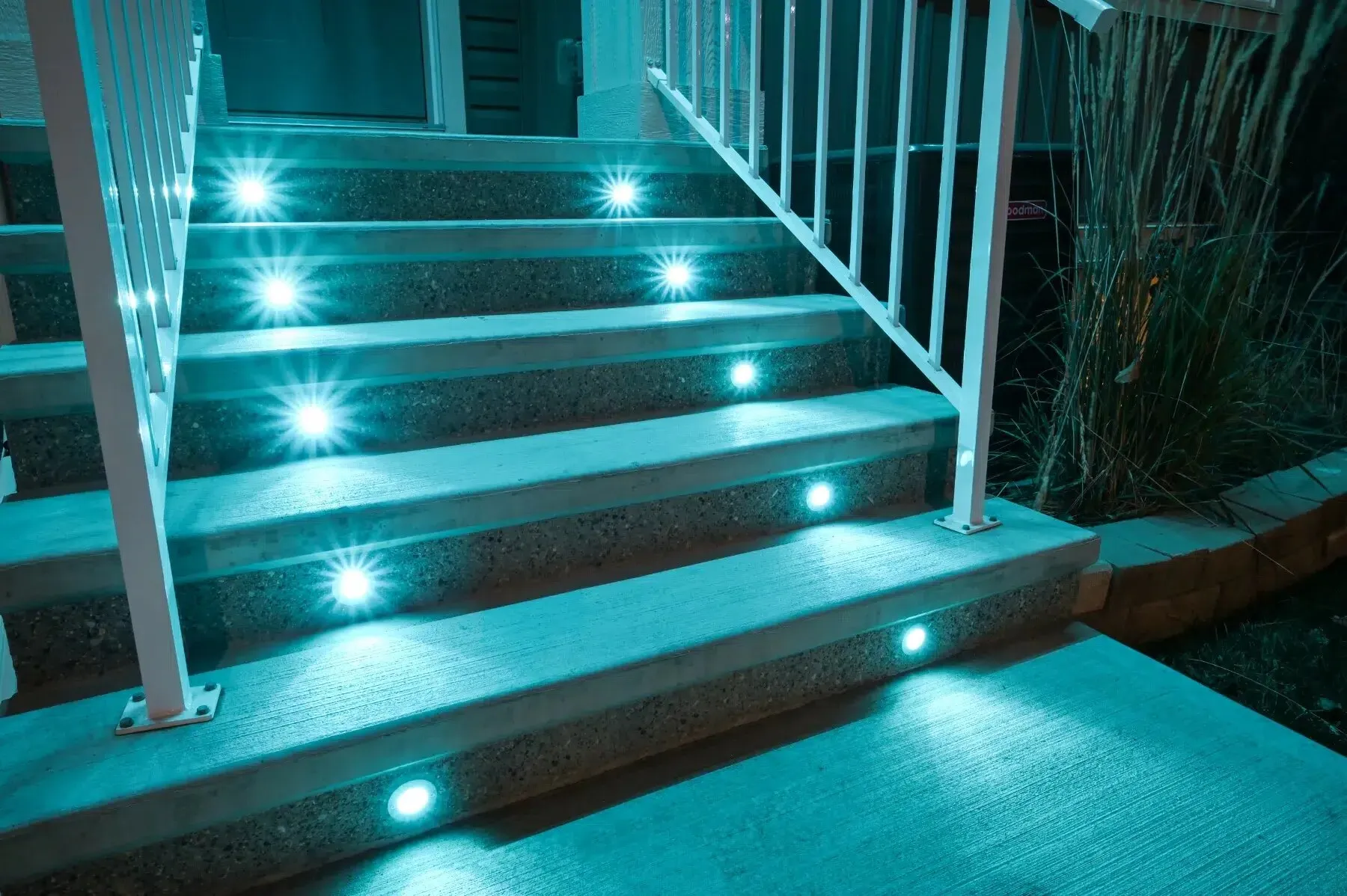 Concrete stairs with teal deck lights