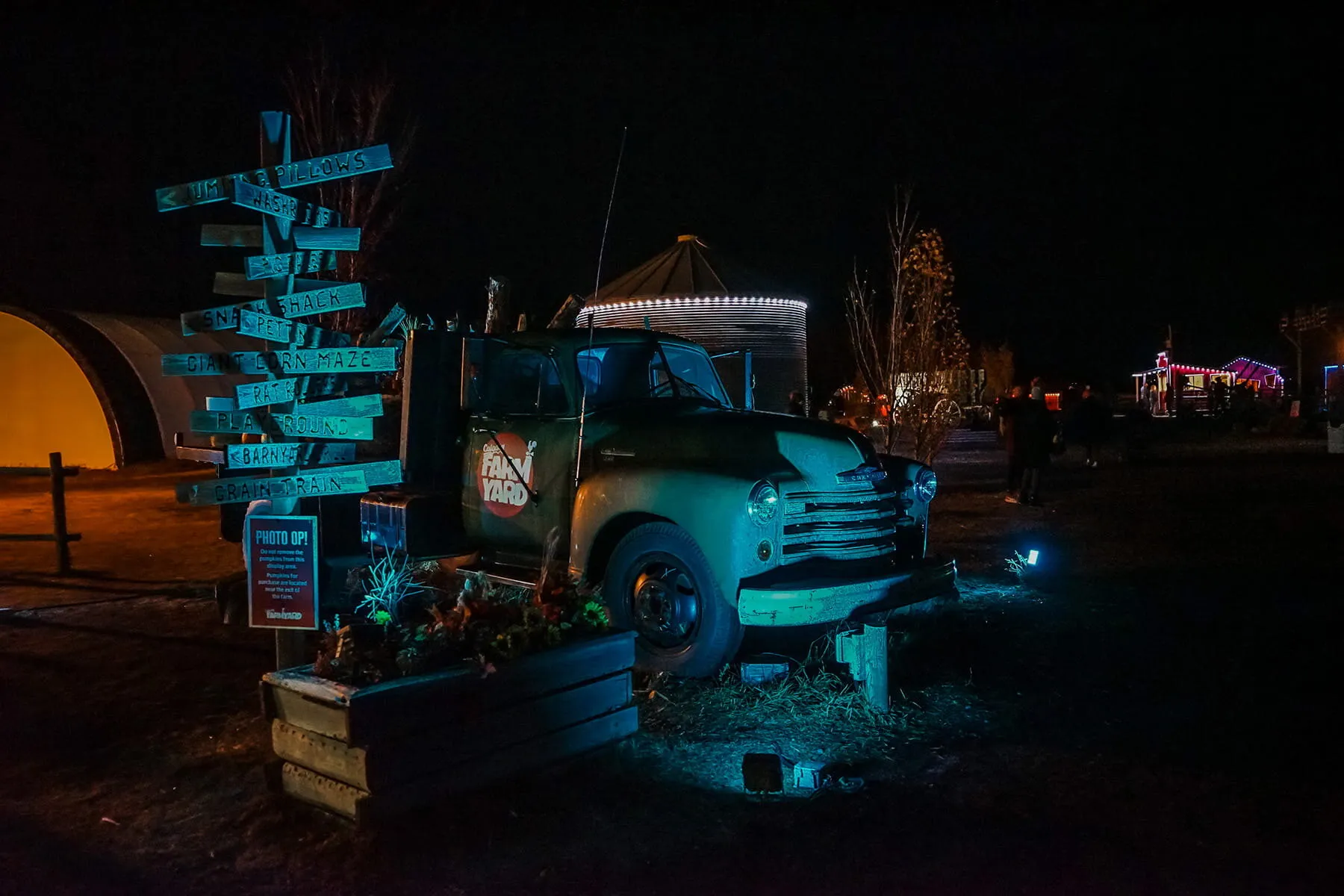 Vintage truck yard feature lit in teal at night